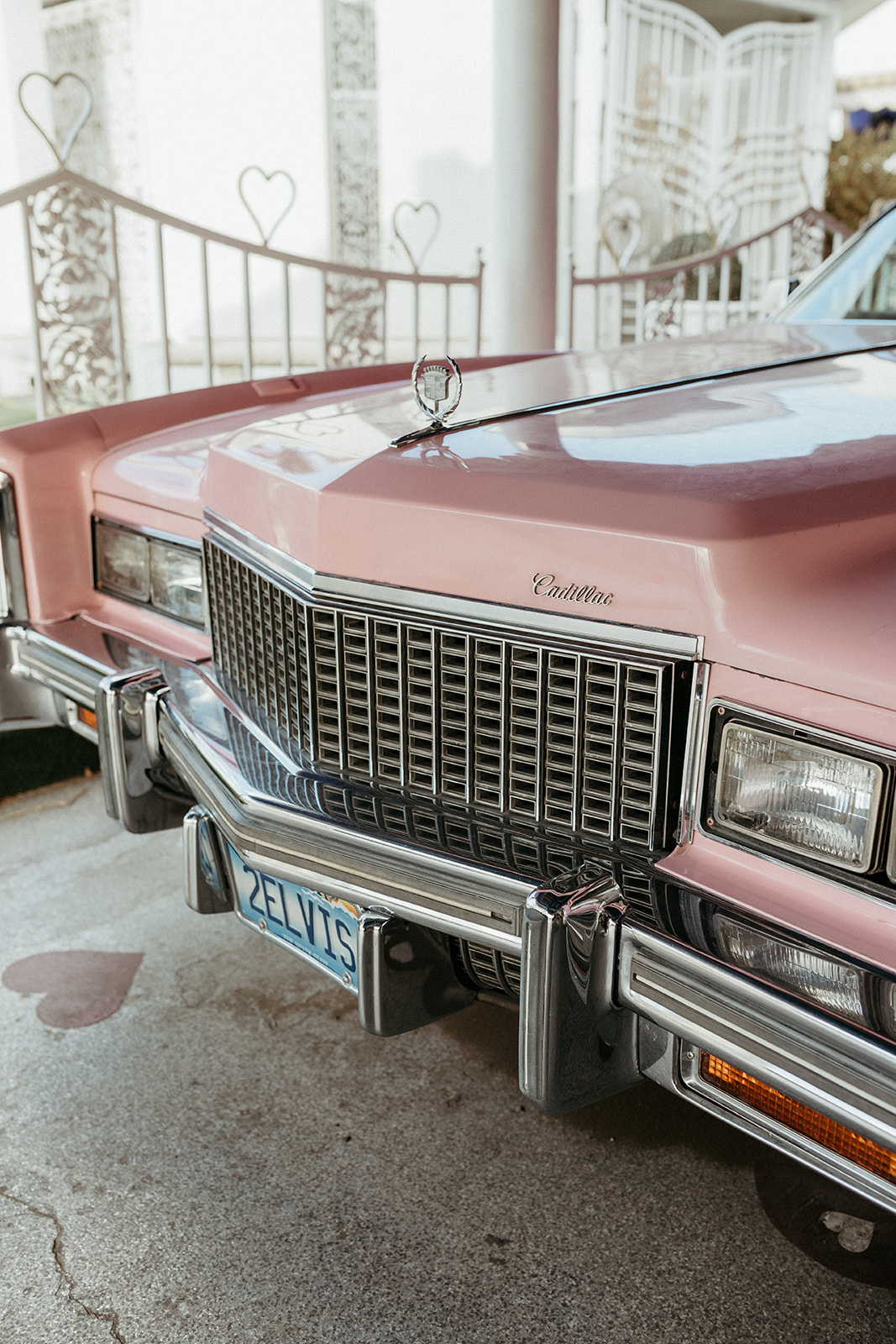 Front End of Pink Cadillac in Little White Wedding Chapel Modern Vegas Wedding 