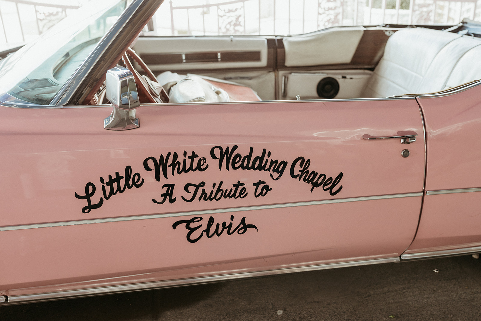 "Little White Wedding Chapel- A Tribute to Elvis" Painted on the Pink Cadillac in Little White Wedding Chapel