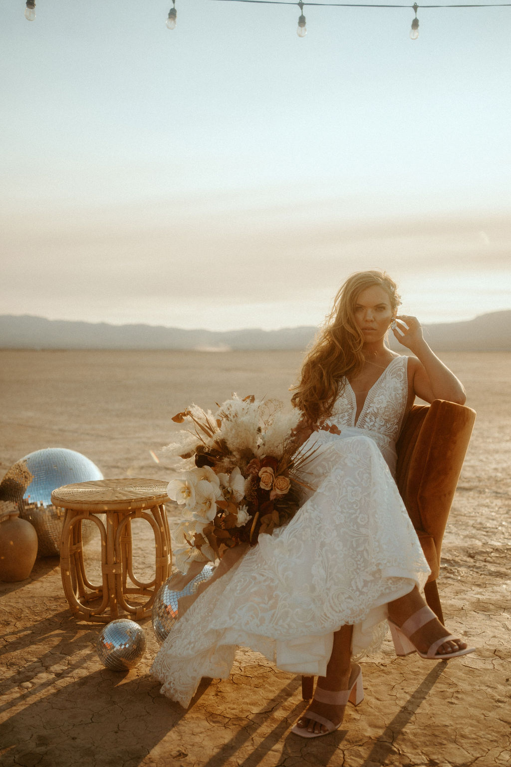 Bride using Velvet Chair as Photo Prop in Las Vegas Desert 