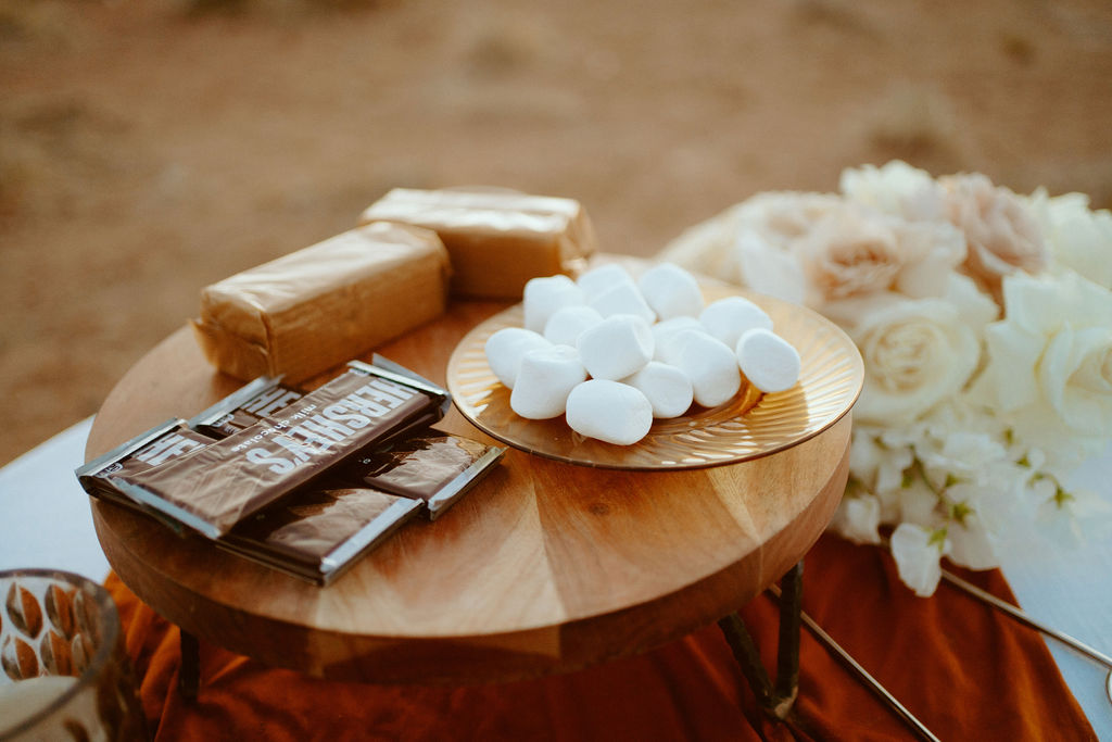 Micro-Wedding Reception at Ash Springs. S'mores set up  with Hershey's chocolate bards, graham crackers, and marshmallow's for the newlyweds. 
