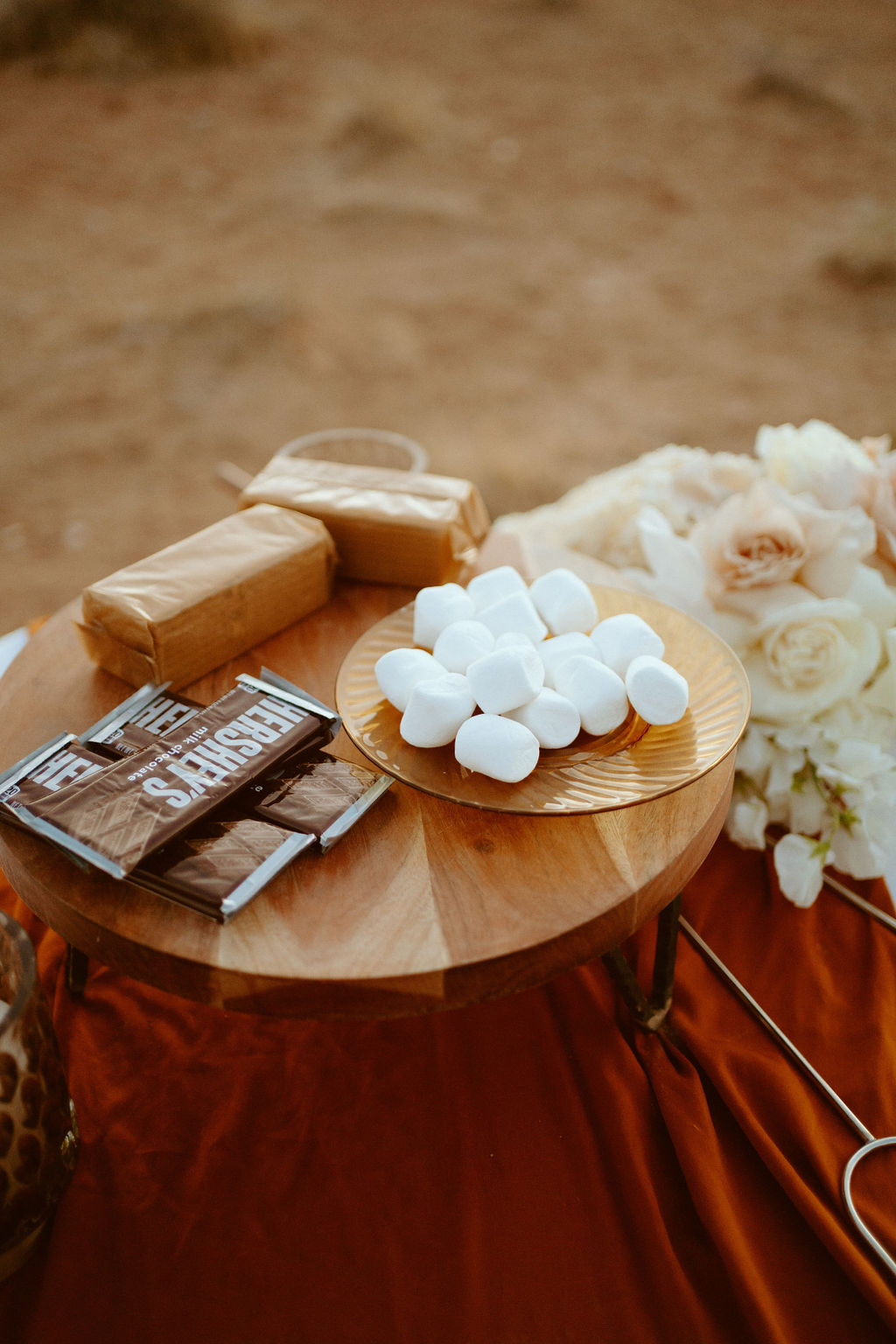 Table set up with Hershey's chocolate bars, graham crackers, and marshmallow's for s'mores.