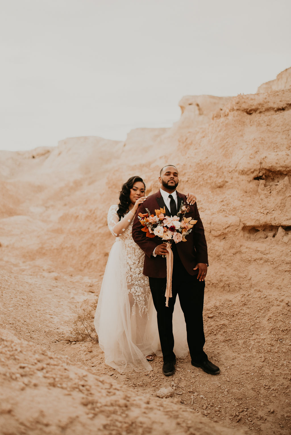 Fossil Beds Sunset Elopement. Photo of newlywed in the middle of the beautiful desert landscape of the fossil beds in tule springs. 