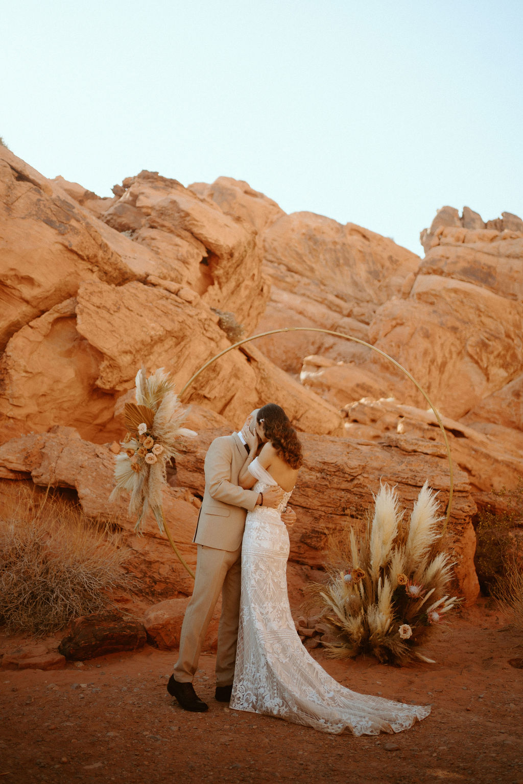 Newlyweds first kiss in the desert 