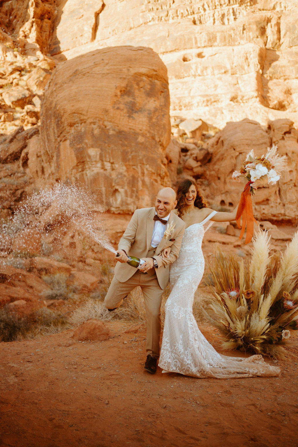 Champagne Spray for Newlyweds in Desert 