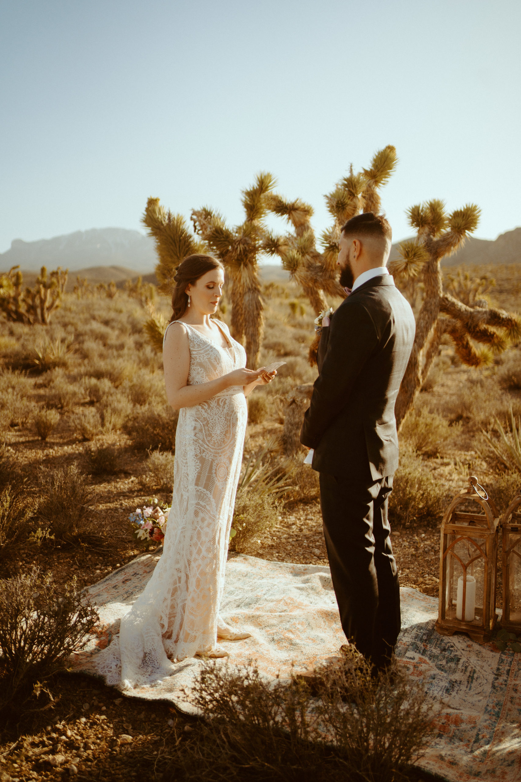 Couple sharing vows with Joshua trees surrounding them for our Joshua Trees in Las Vegas? No Way Blog 