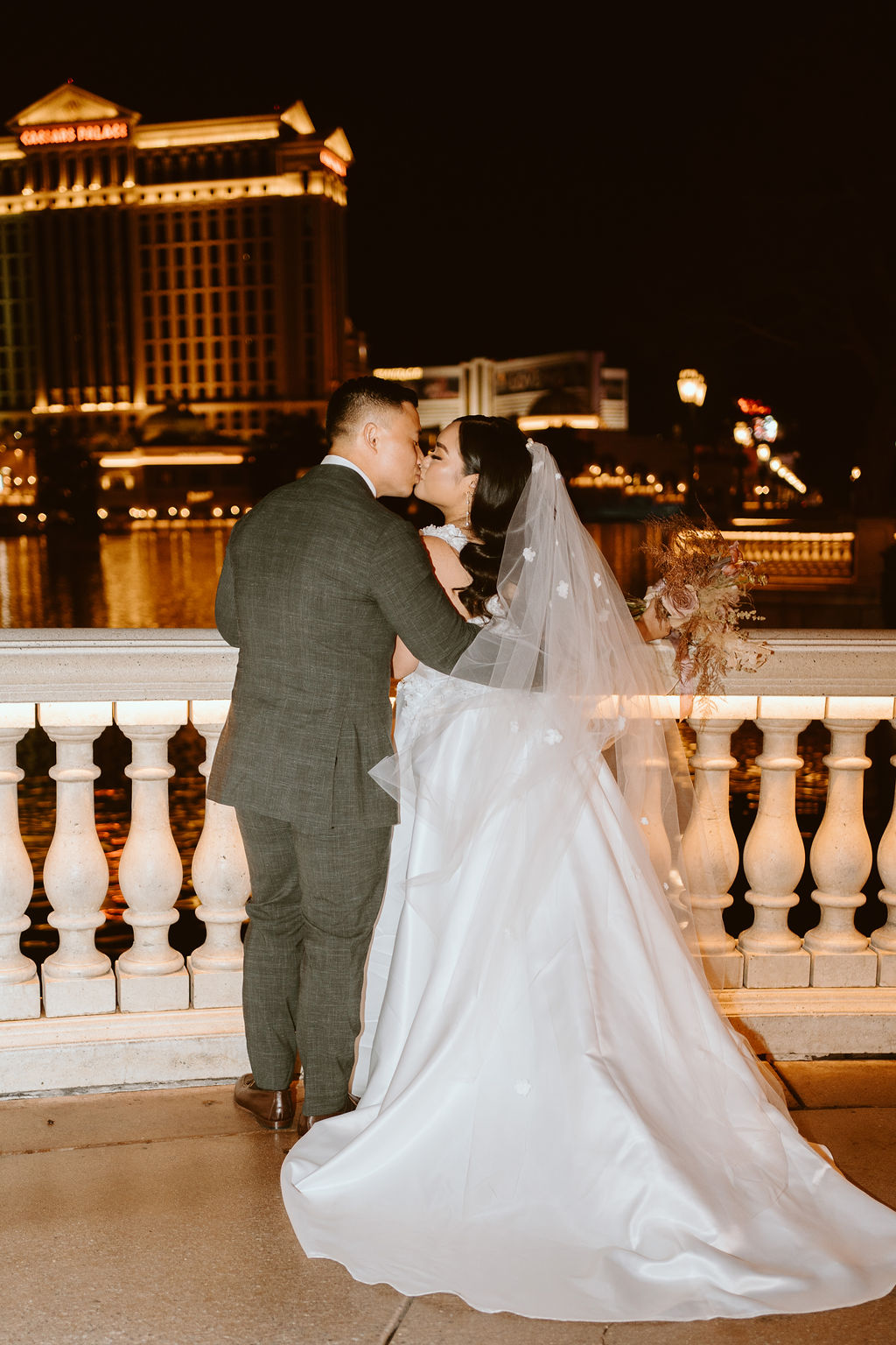 Couple Kissing by The Bellagio Fountains before Elopement 