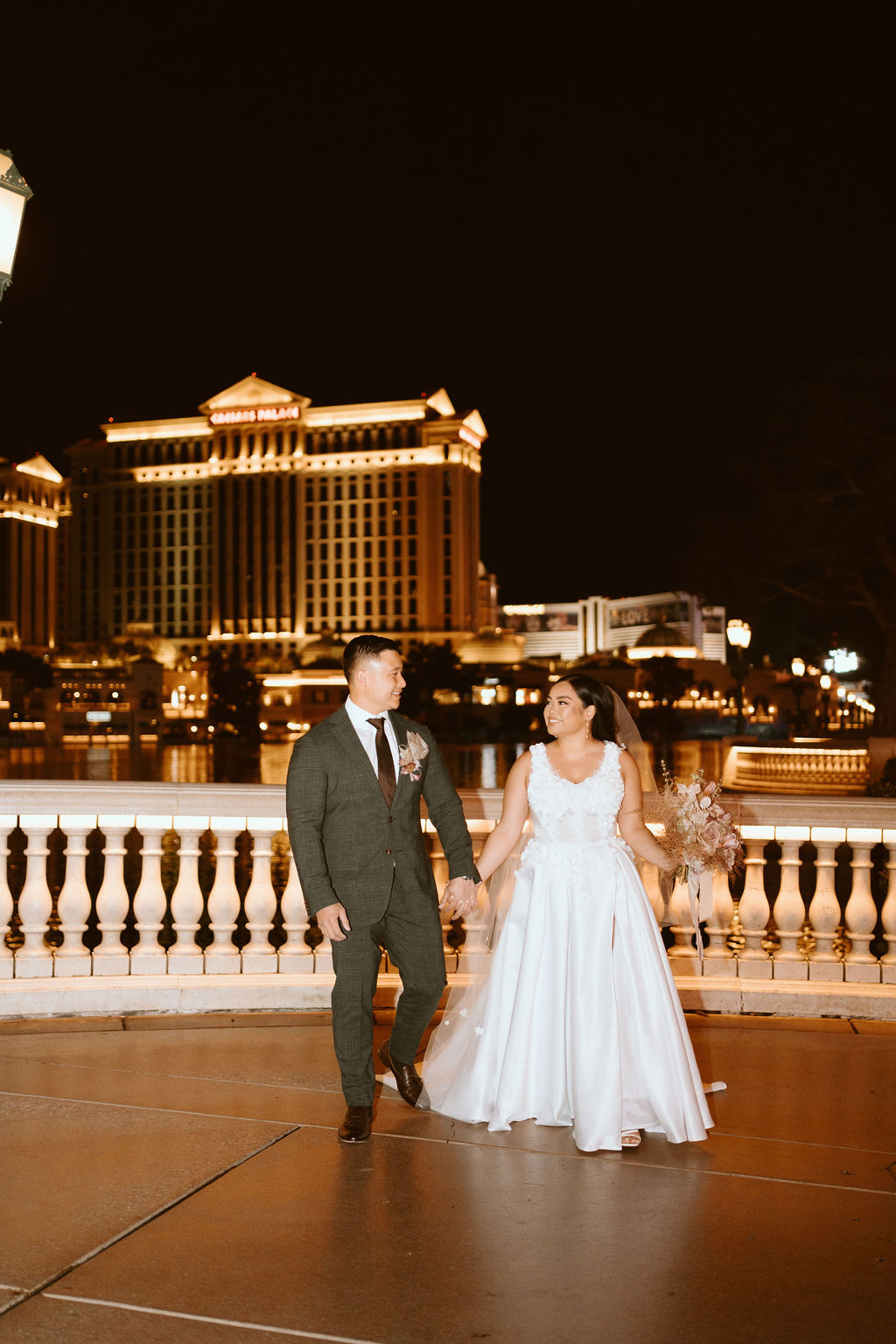 Couple Walking by The Bellagio Fountains before Elopement 