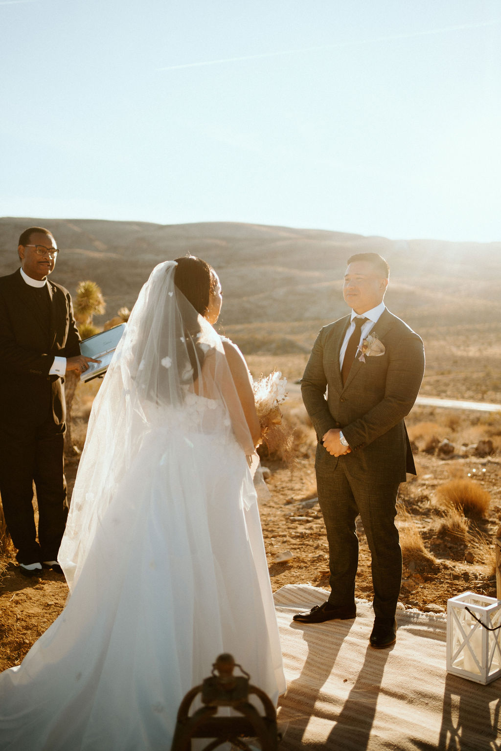 Couple looking at one another at altar in Las Vegas desert elopement 