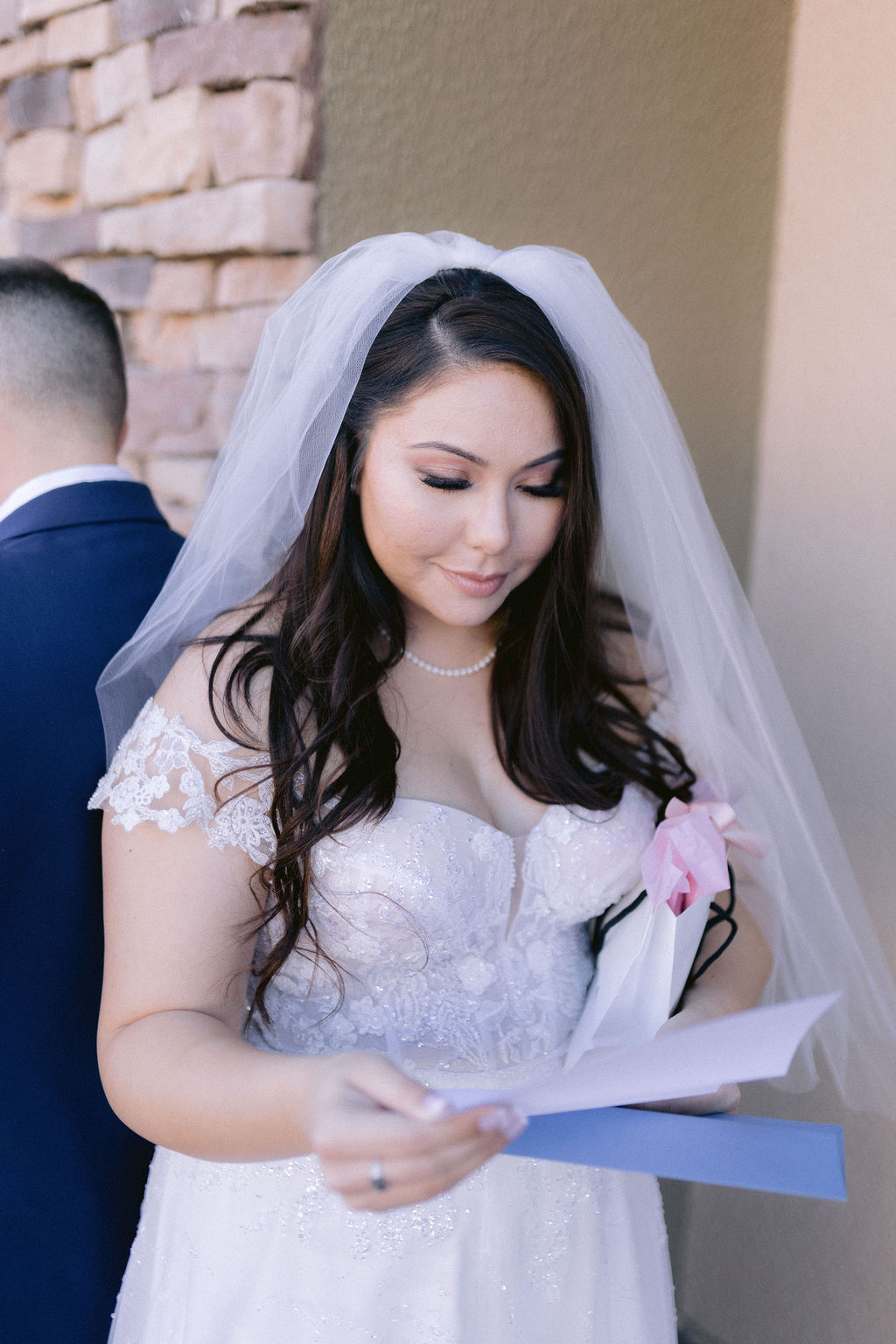 Navy Blue & Blush Pink Micro-Wedding Bride reading a personalized letter from the groom. 