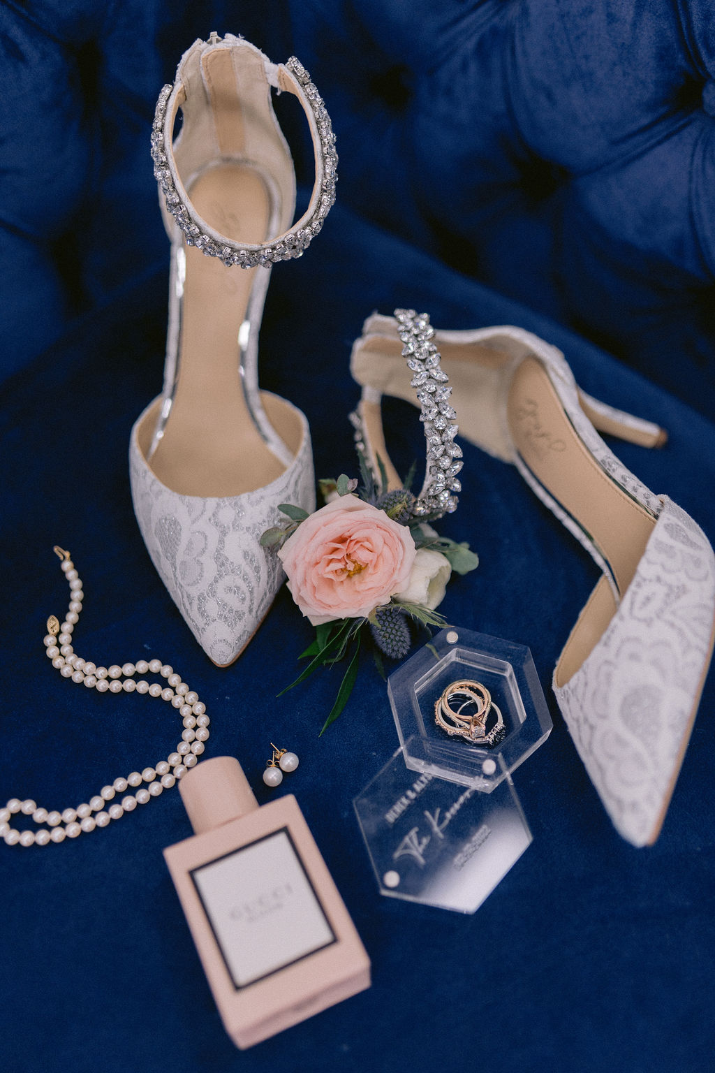Navy Blue & Blush Pink Micro-Wedding photo of the brides lace high heals with grooms boutonniere and her pearls. 