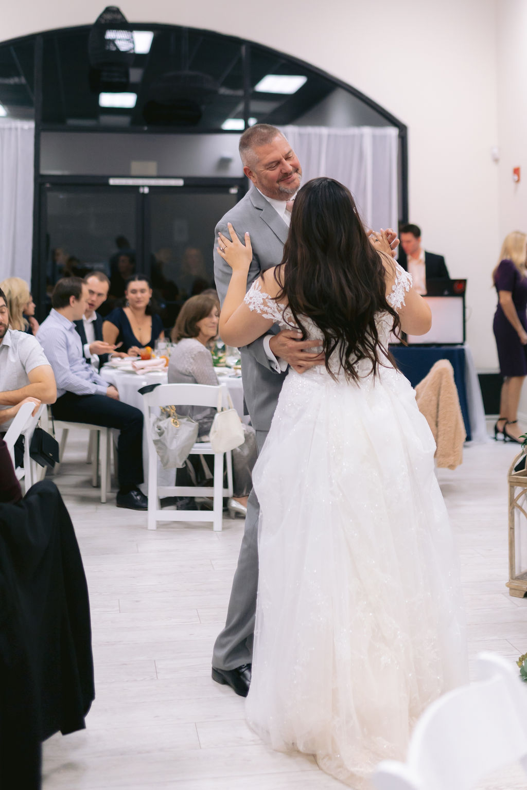 Bride and her father share the daddy daughter dance. 