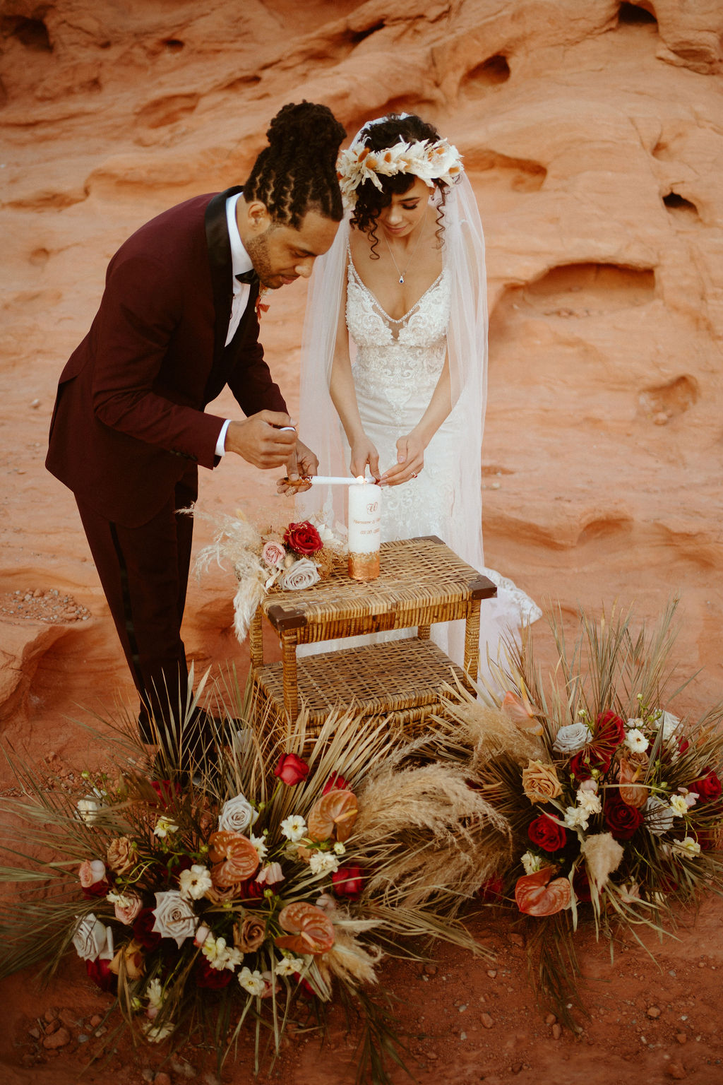 Romantic Mauve & Desert Hues Elopement bride and groom lighting their white and cold unity candle. 