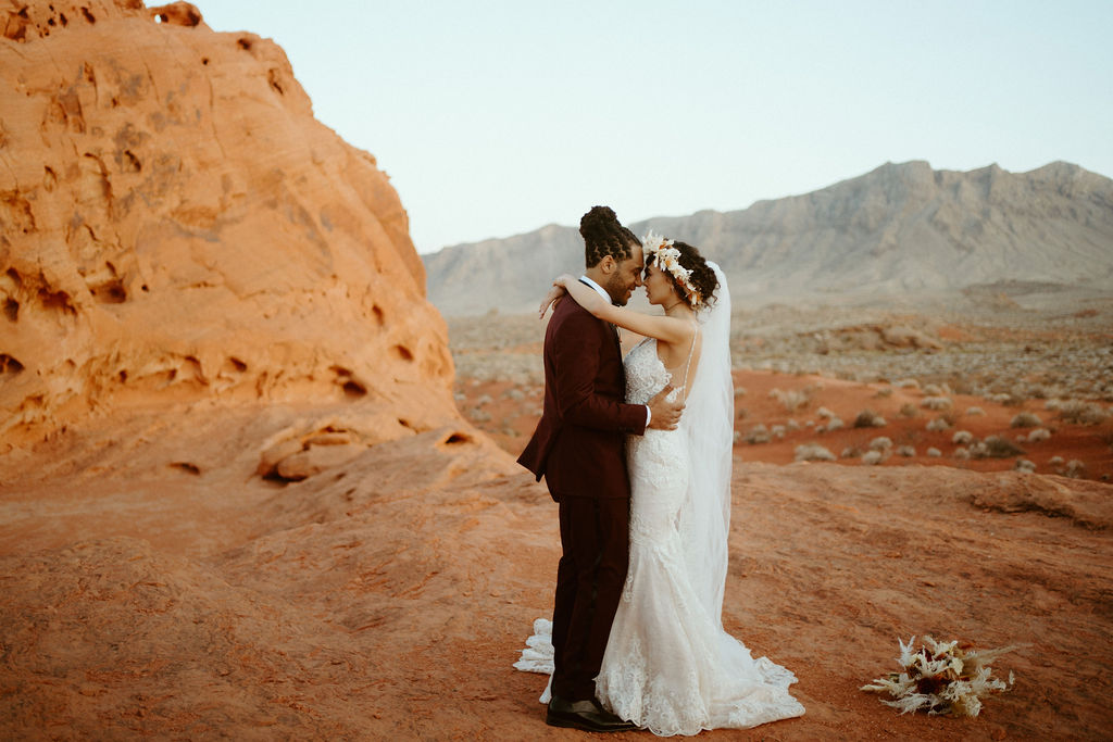 Romantic Mauve & Desert Hues Elopement bride and groom sharing their first dance in the Valley of Fire.