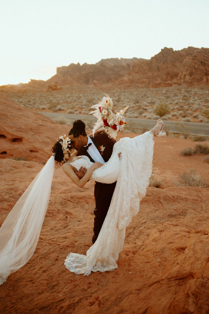 Romantic Mauve & Desert Hues Elopement groom dipping his bride in a kiss. 