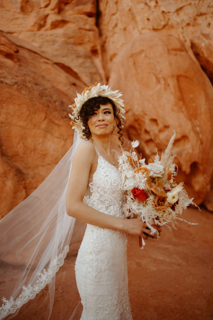Romantic Mauve & Desert Hues Elopement close up of bride holding her desert matching floral bouquet. 