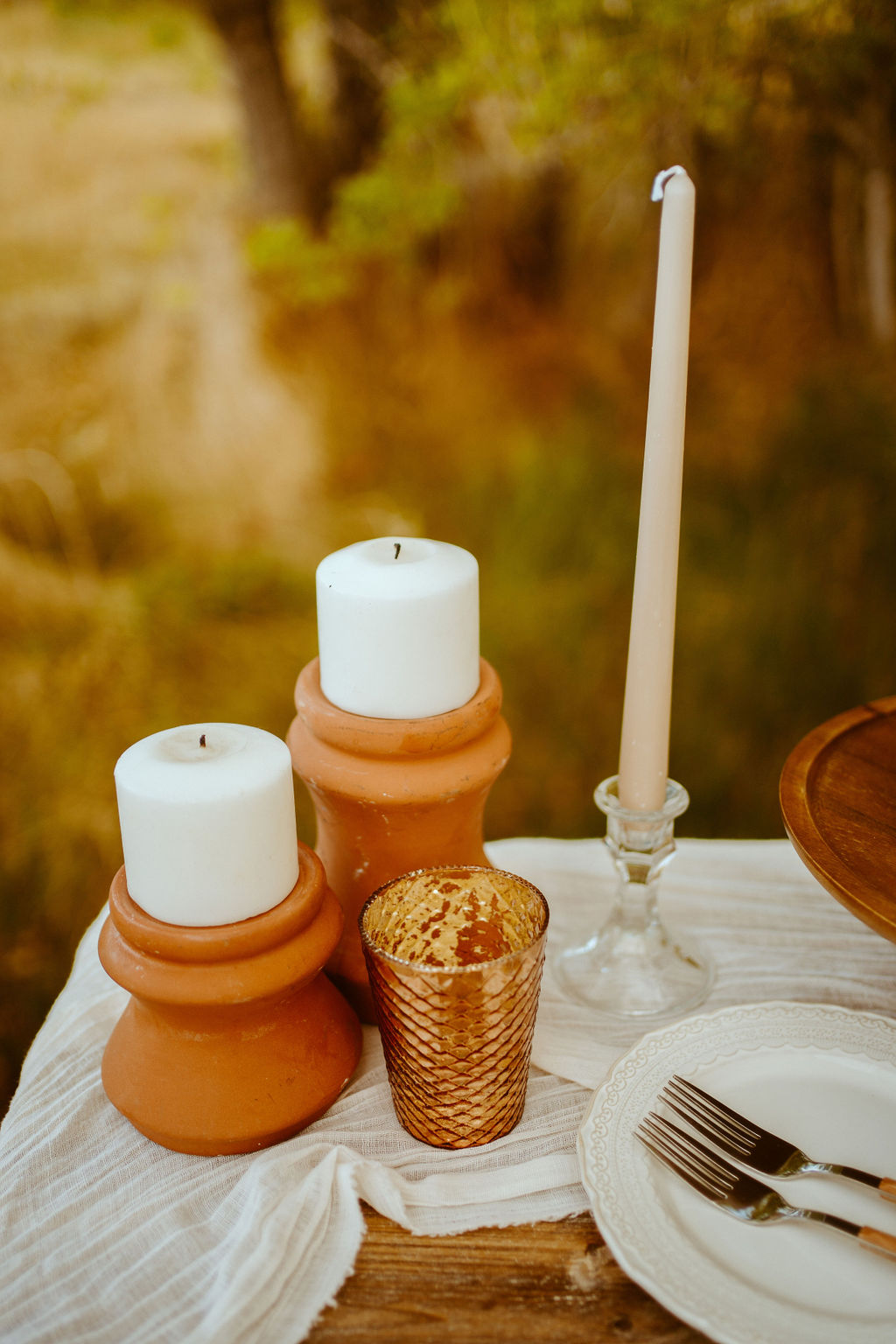 Close up of the ceramic dark oragne candle stick holders and tee light candles. 