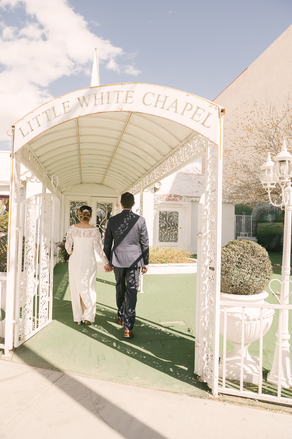Newlyweds enter the Little White Wedding Chapel in Las Vegas