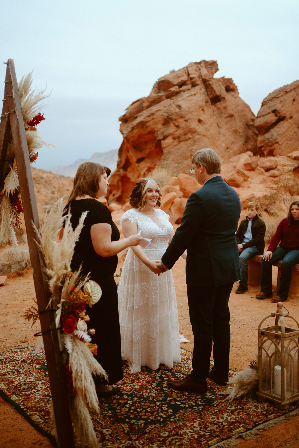 Couple holding hands at altar during Visitor Center Valley of Fire Elopement