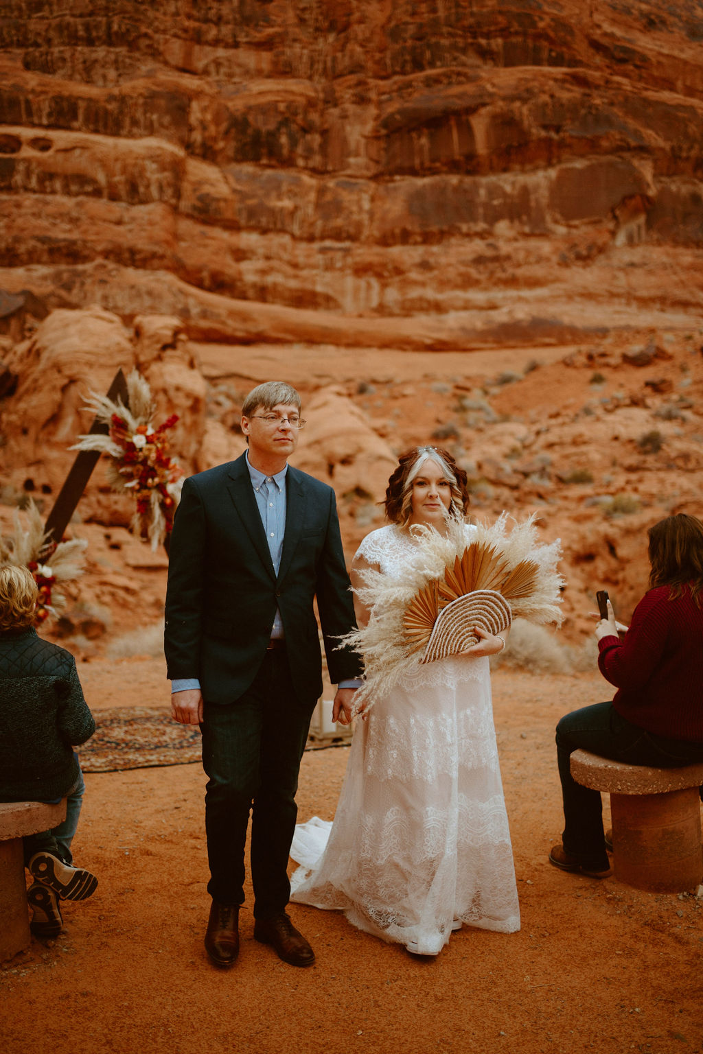 Newlyweds exiting ceremony during boho chic elopement 