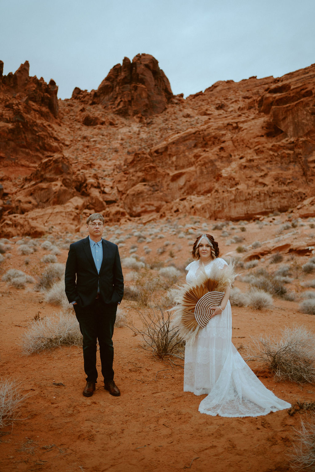 Bride and Groom Standing in Scenic Red Rock Desert at Visitor Center Valley of Fire Elopement