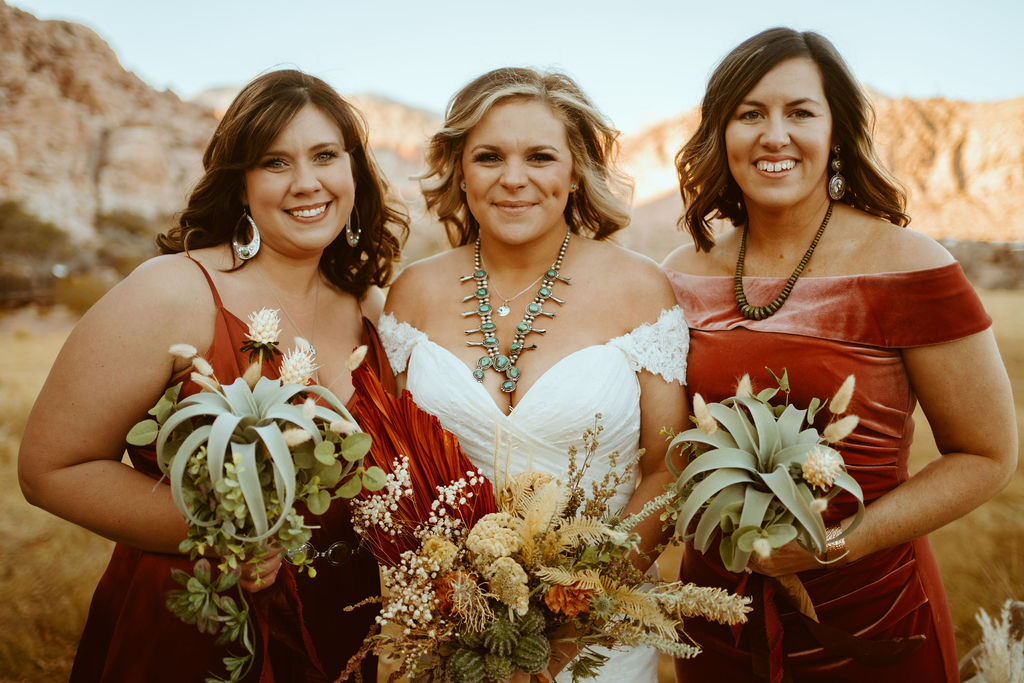 Bride with Turquoise necklace and Bridesmaids with Dried Desert Floral Bouquets 