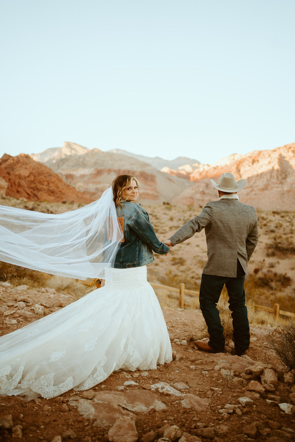 Bride in Custom Jean Jacket and Mermaid Dress with Groom in Red Rock Canyon 