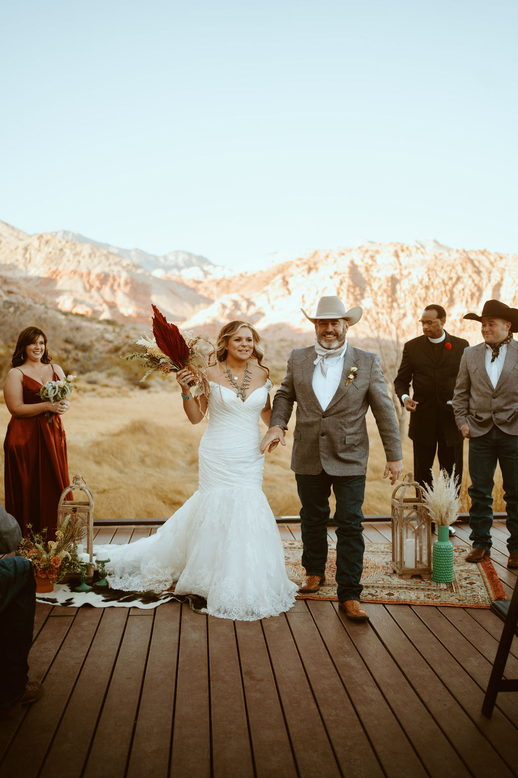 Newlyweds exiting in Western Inspired Turquoise Boho Elopement 
