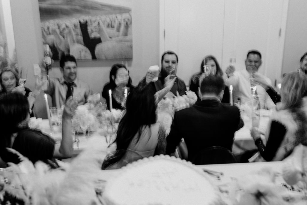 Black and White Photo of Guests doing Toast for Modern Vegas Wedding Reception 