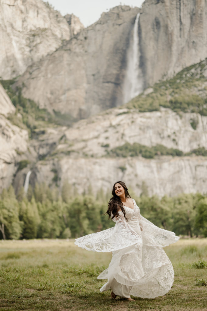 Boho bride in boho style wedding dress with long flowing lace sleeves