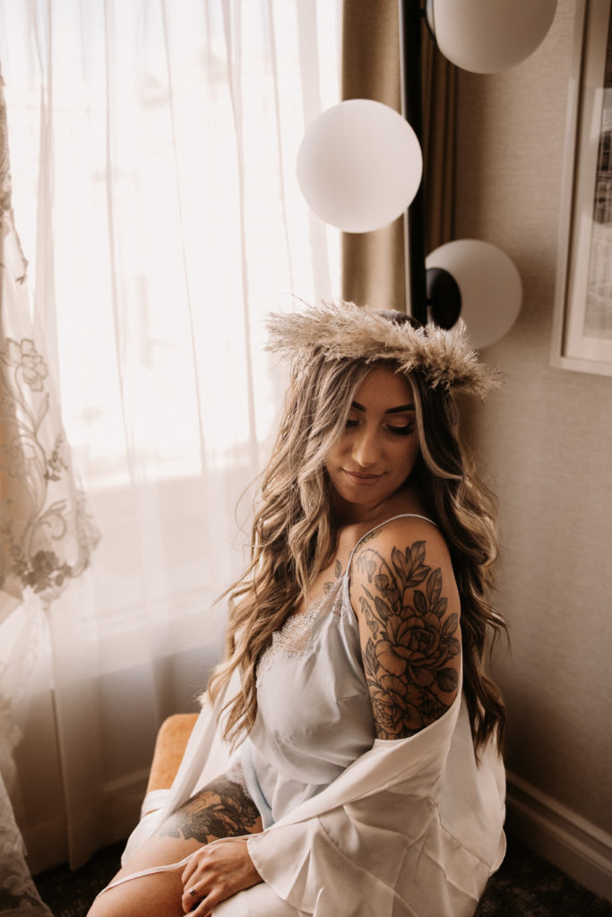 What is a boho styled wedding. Boho bride in a pampas head crown with long beachy waves