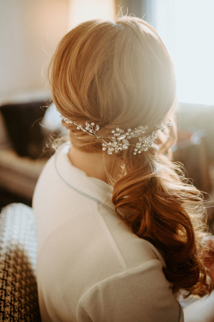 What is a Rustic & Whimsical Styled Wedding? Bridal hair and jeweled hair accessories in side loose braid