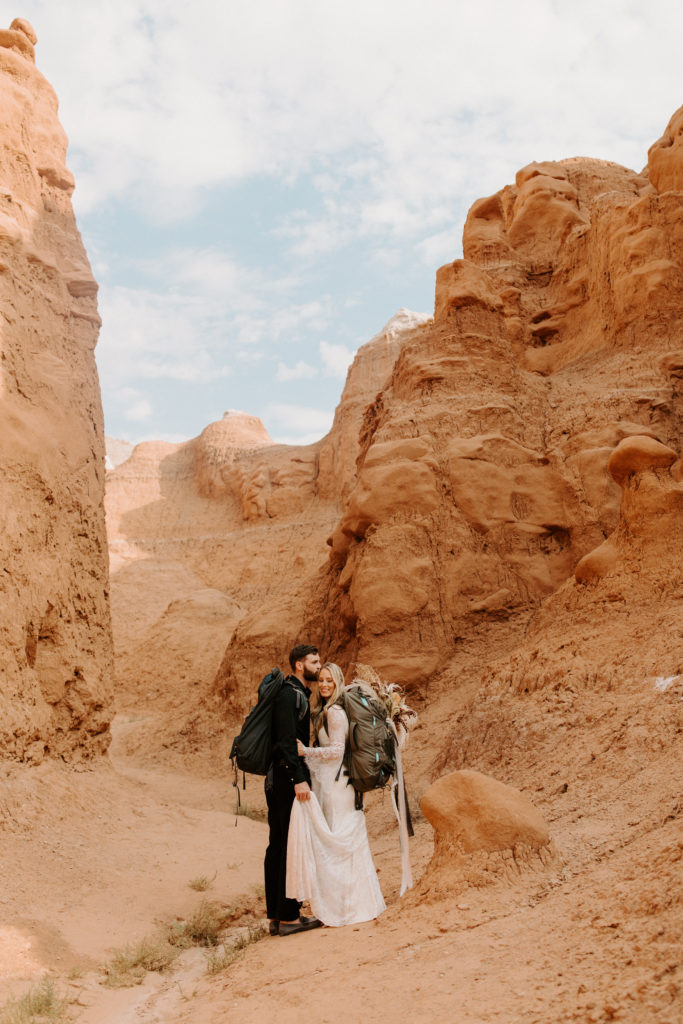 How to decide if you want an elopement or traditional wedding. Newlyweds hiking up goblin state park for vows