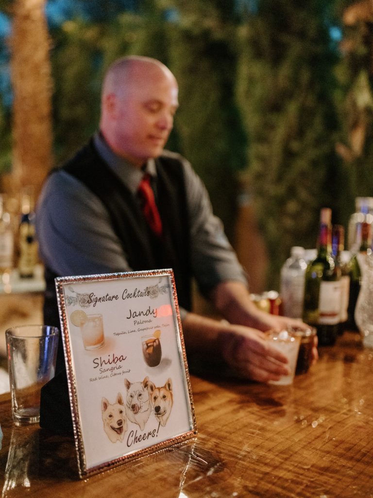How To Include Your Dog on Your Wedding Day! Signature cocktail sign with a custom photo of the couples dog and the drinks that are named after each dog. 