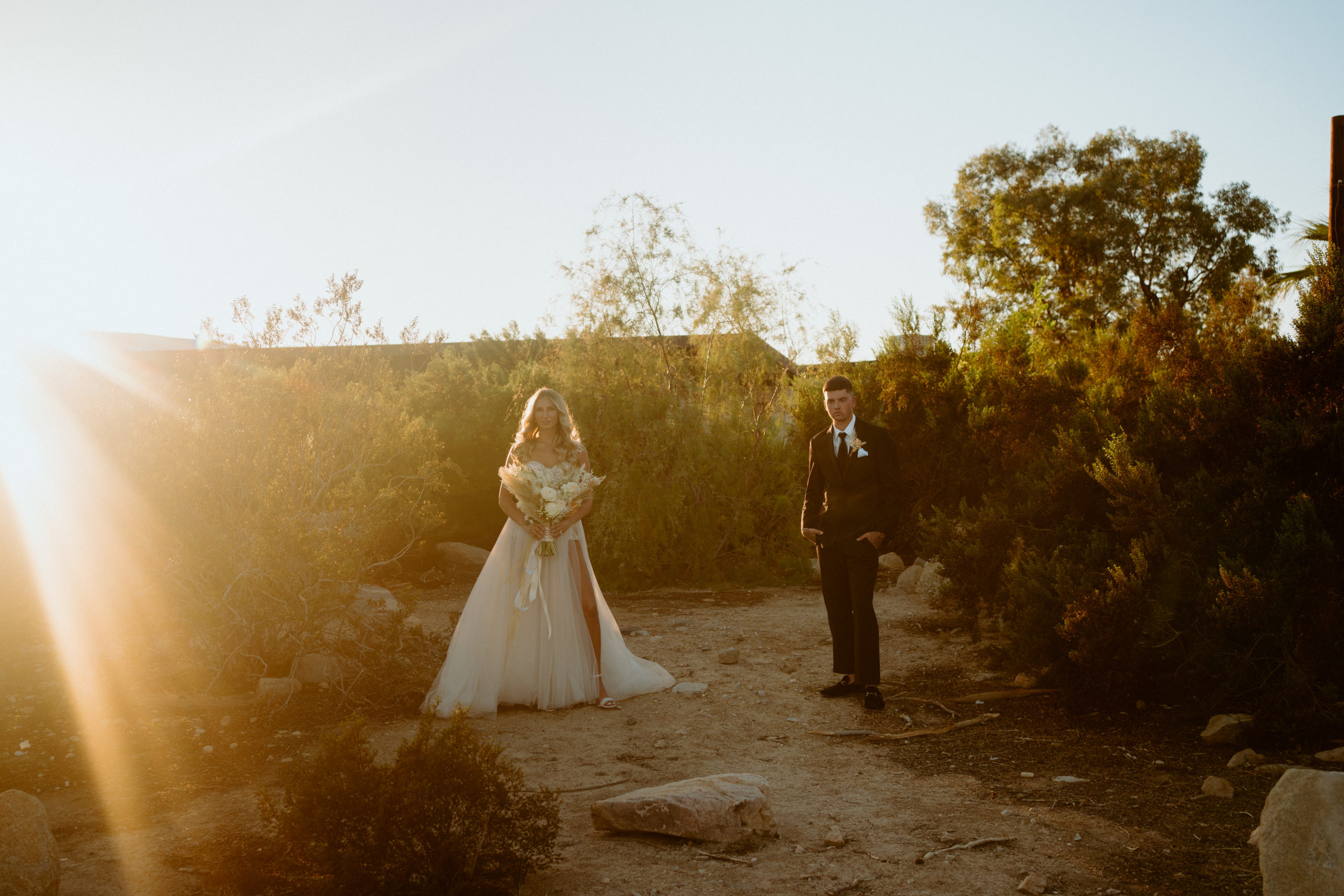 What is a Timeless & Romantic Styled Wedding. Newlyweds in Joshua Tree  standing in the middle of the desert.