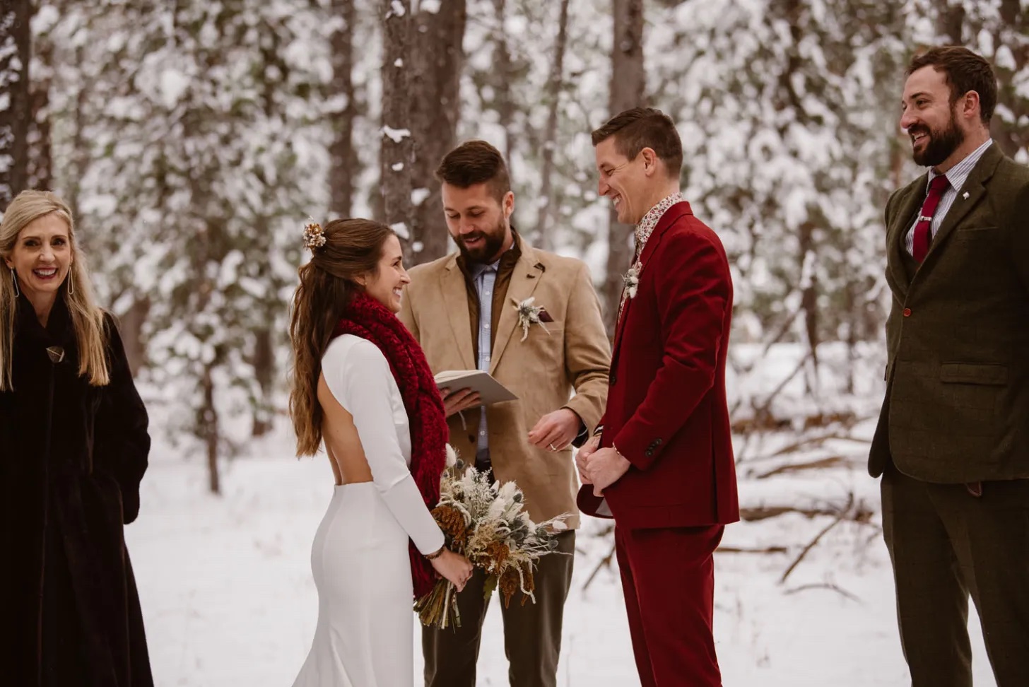 Couple with holiday theme getting married in the snowy forest. 5 Rules when it comes to Planning a Wedding close to the Holidays