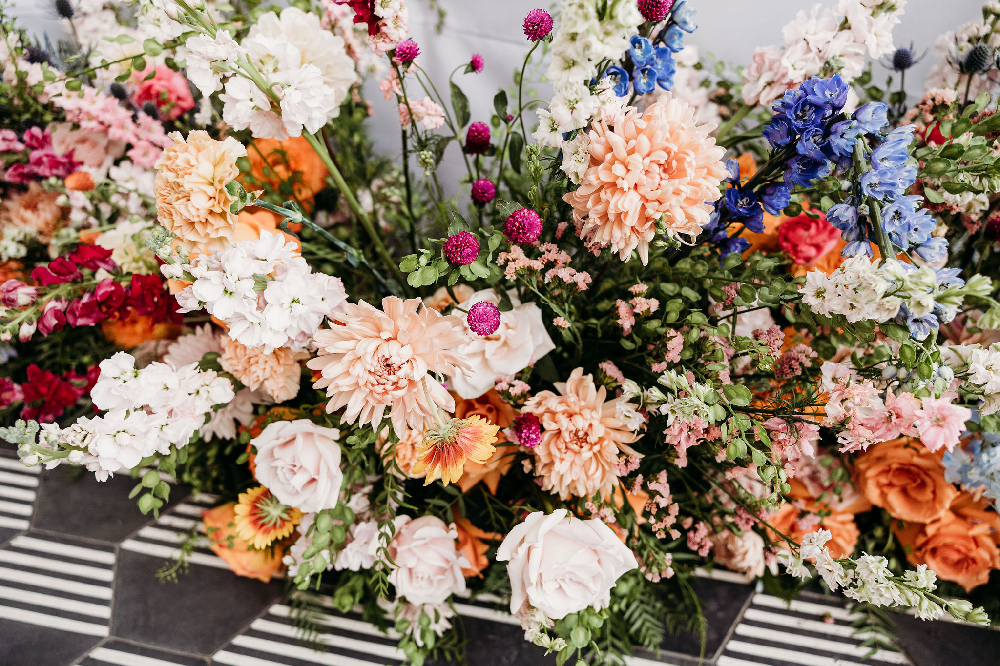 The Official List of 2023 Wedding Trends! Vibrant jewel tone florals for sweetheart table 