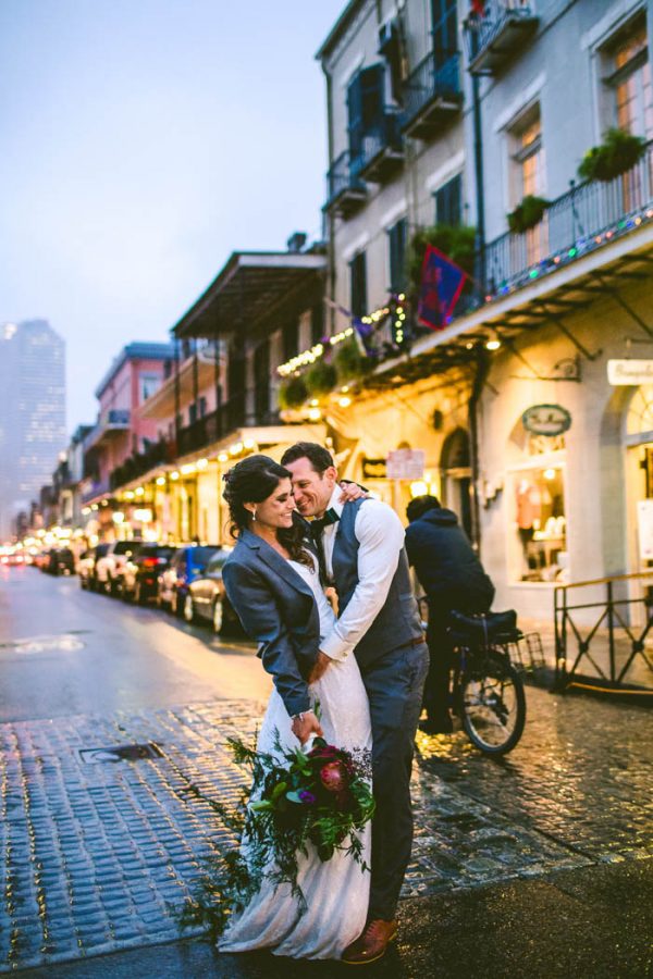 Bride and groom kissing on St. Charles Ave in New Orleans