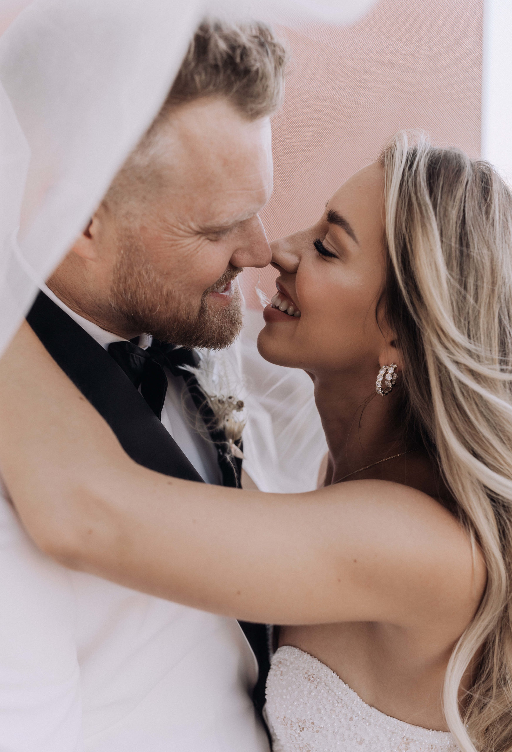 Lake Las Vegas Meets Modern Boho Bride. Newlyweds kissing under veil
