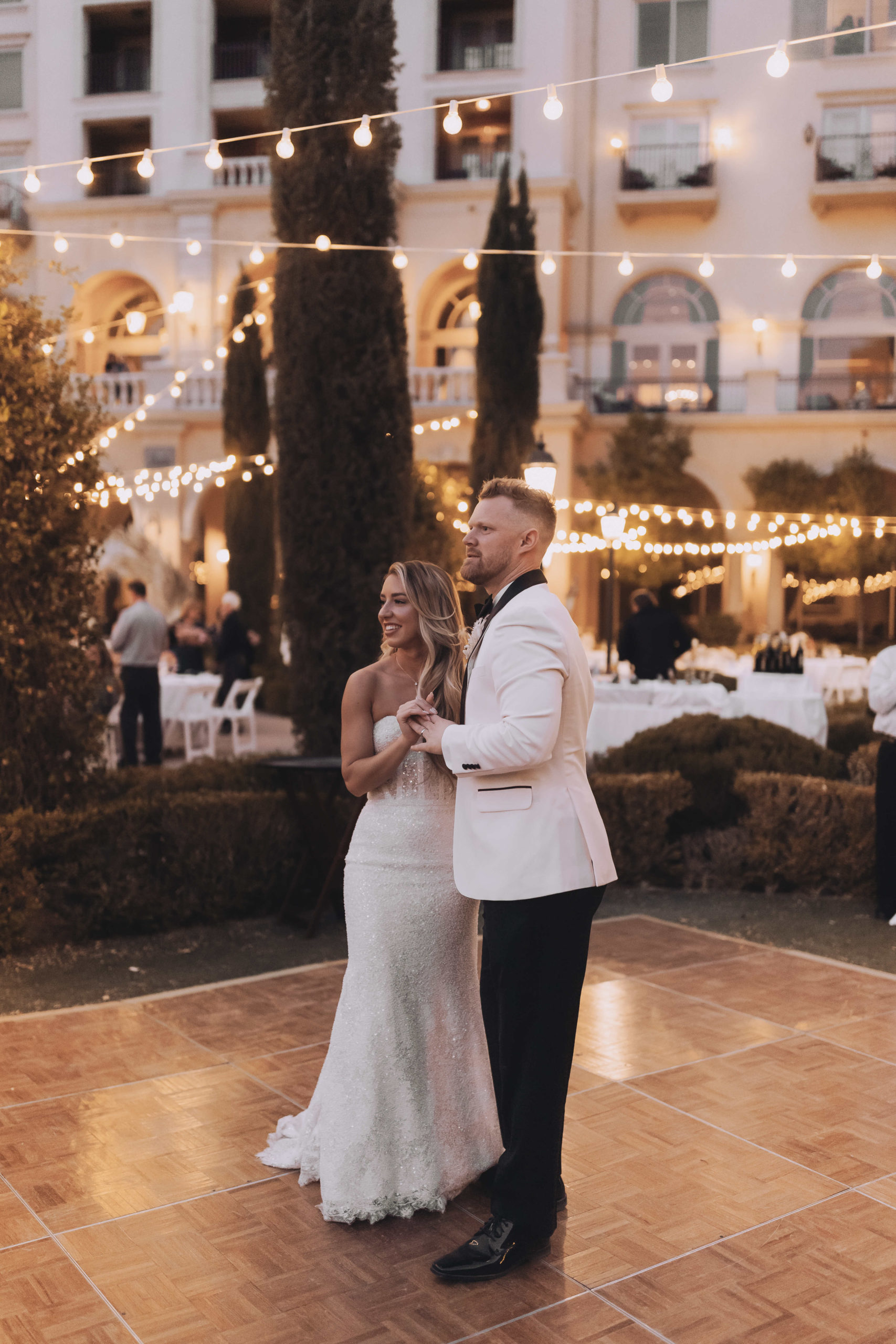 Lake Las Vegas Meets Modern Boho Bride. First dance as Mr. and Mrs. to Livin on love that was sung by one of the groomsmen.