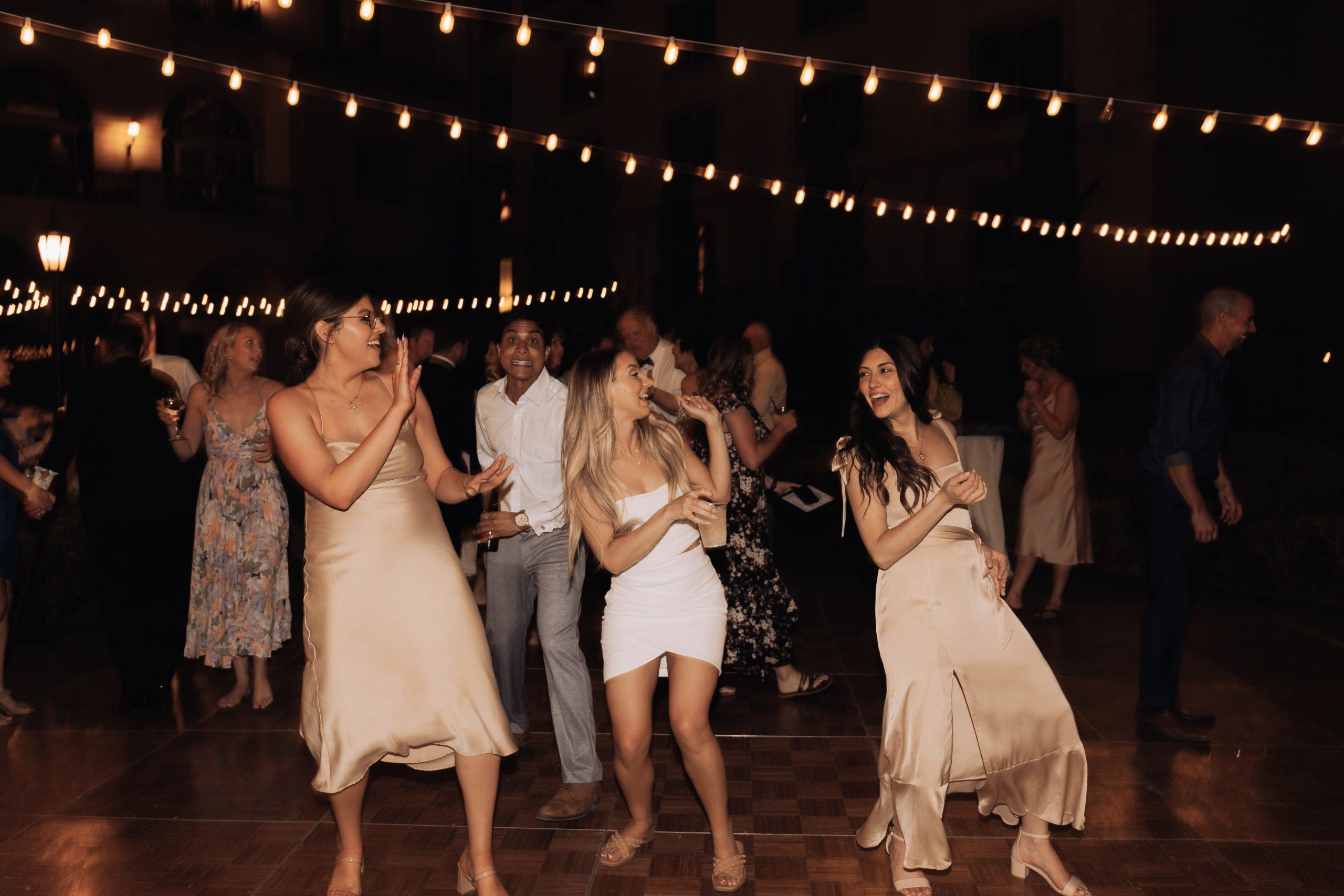 Lake Las Vegas Meets Modern Boho Bride. Bride changes into a second outfit for reception and hits the dance floor with the bridesmaid and guest