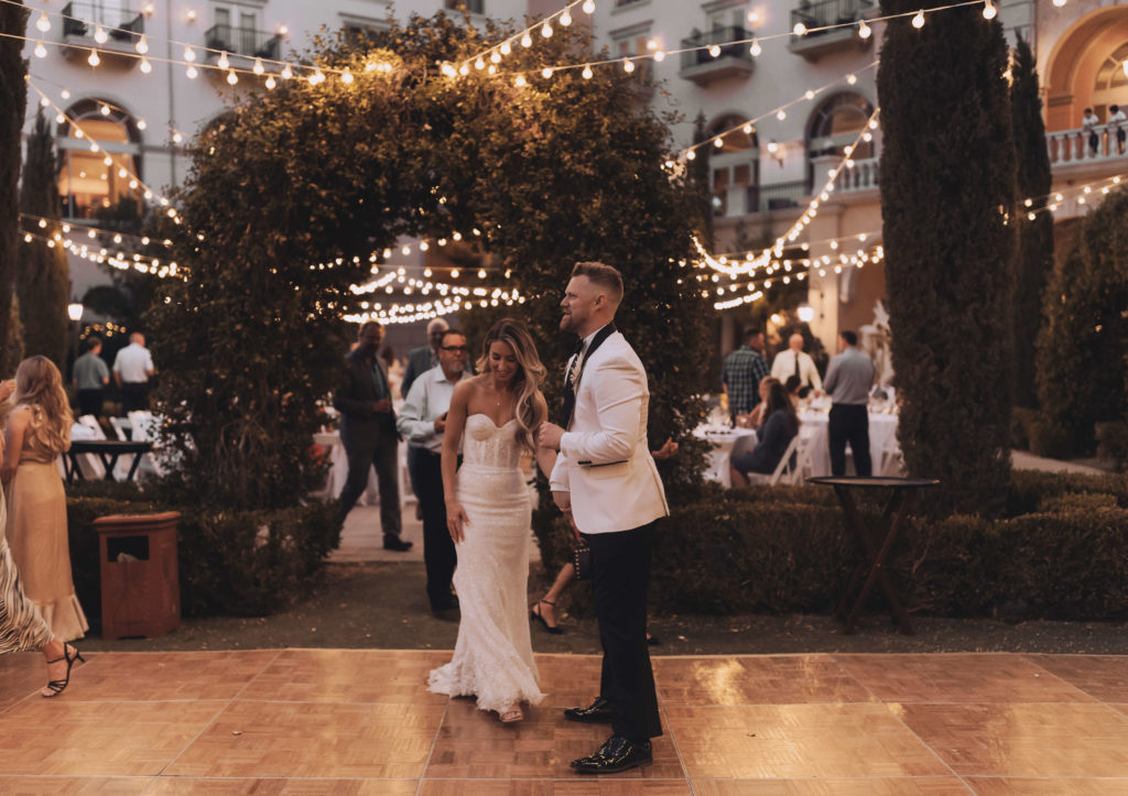 Lake Las Vegas Meets Modern Boho Bride. Newlyweds entering the dance floor for their first dance as a married coiuple