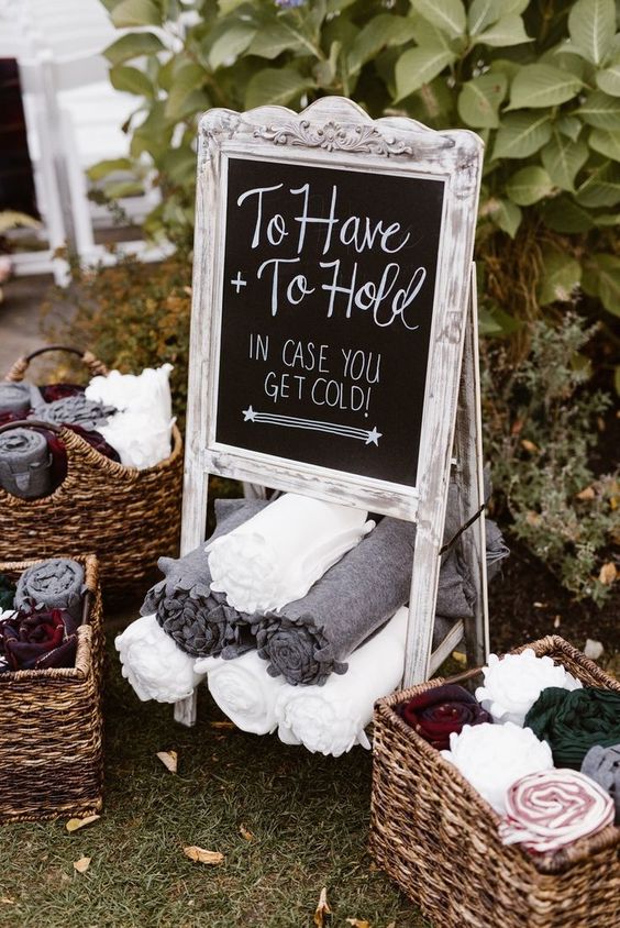 To have and to hold in case you get cold sign and blankets for guests for cold holiday wedding 