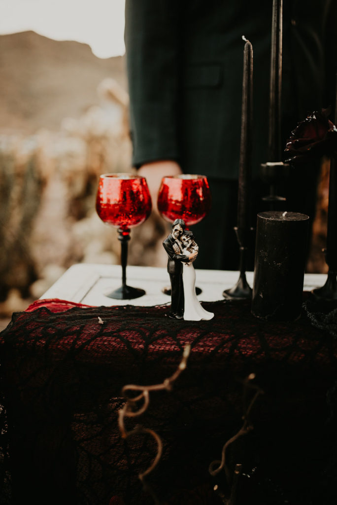 Red and Black Glasses on Cake Table for Halloween Elopement at Nelson's Ghost Town