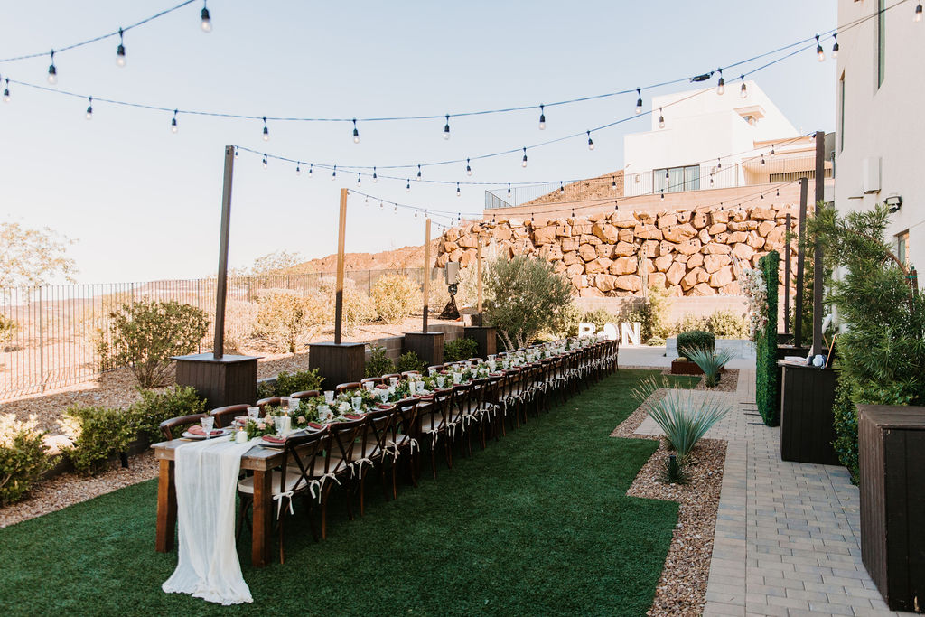 Long banquet style reception table for Romantic Desert & Backyard Micro-Wedding