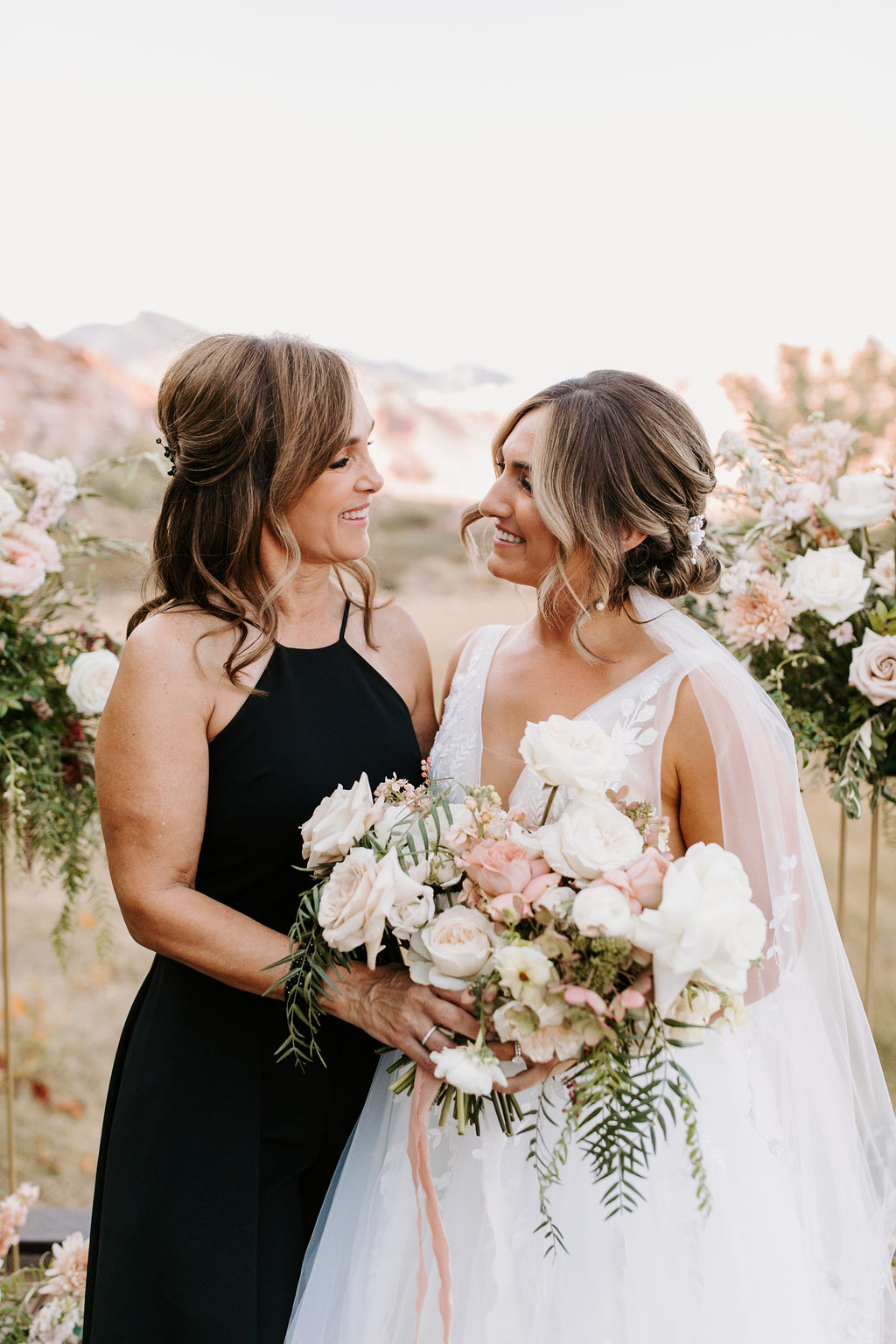 Bride smiling looking at mom for Romantic Desert & Backyard Micro-Wedding