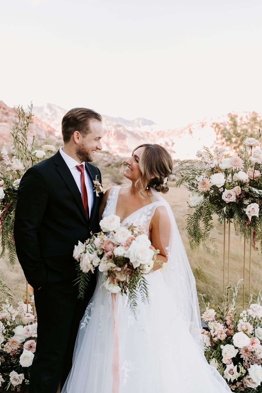 Bride and Groom smiling looking at each other during Romantic Desert & Backyard Micro-Wedding 