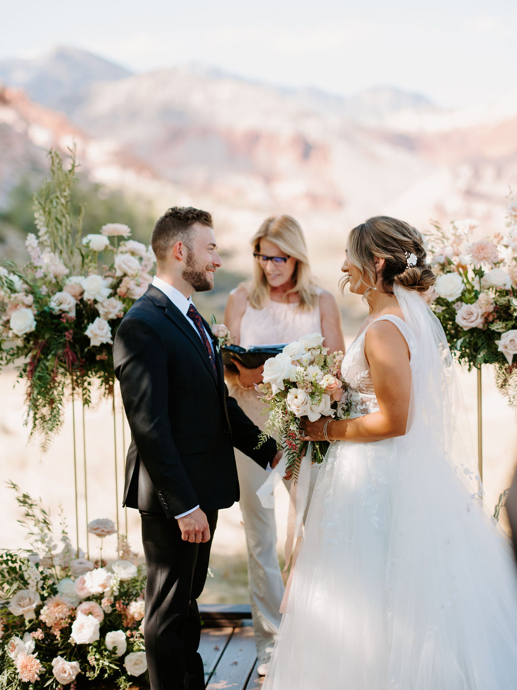 Ceremony Decor with Harlow Stands and Floral and Mountains in the back for Romantic Desert & Backyard Micro-Wedding 
