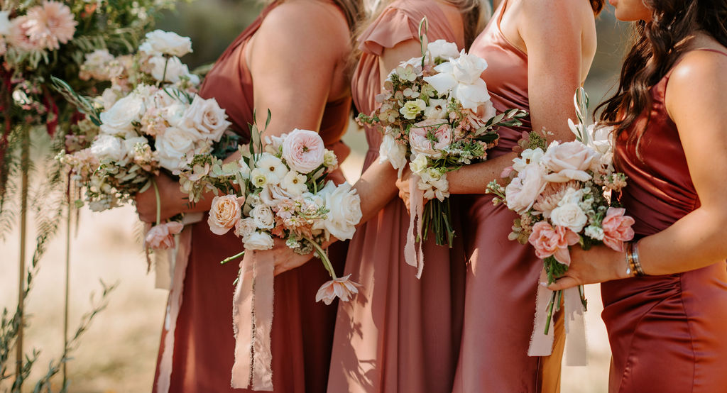 Bridal Party in mauve, dusty rose, dusty rust, and rust bridesmaid dresses with whimsical soft pink, white & sage bridal bouquet bouquets for Romantic Desert & Backyard Micro-Wedding