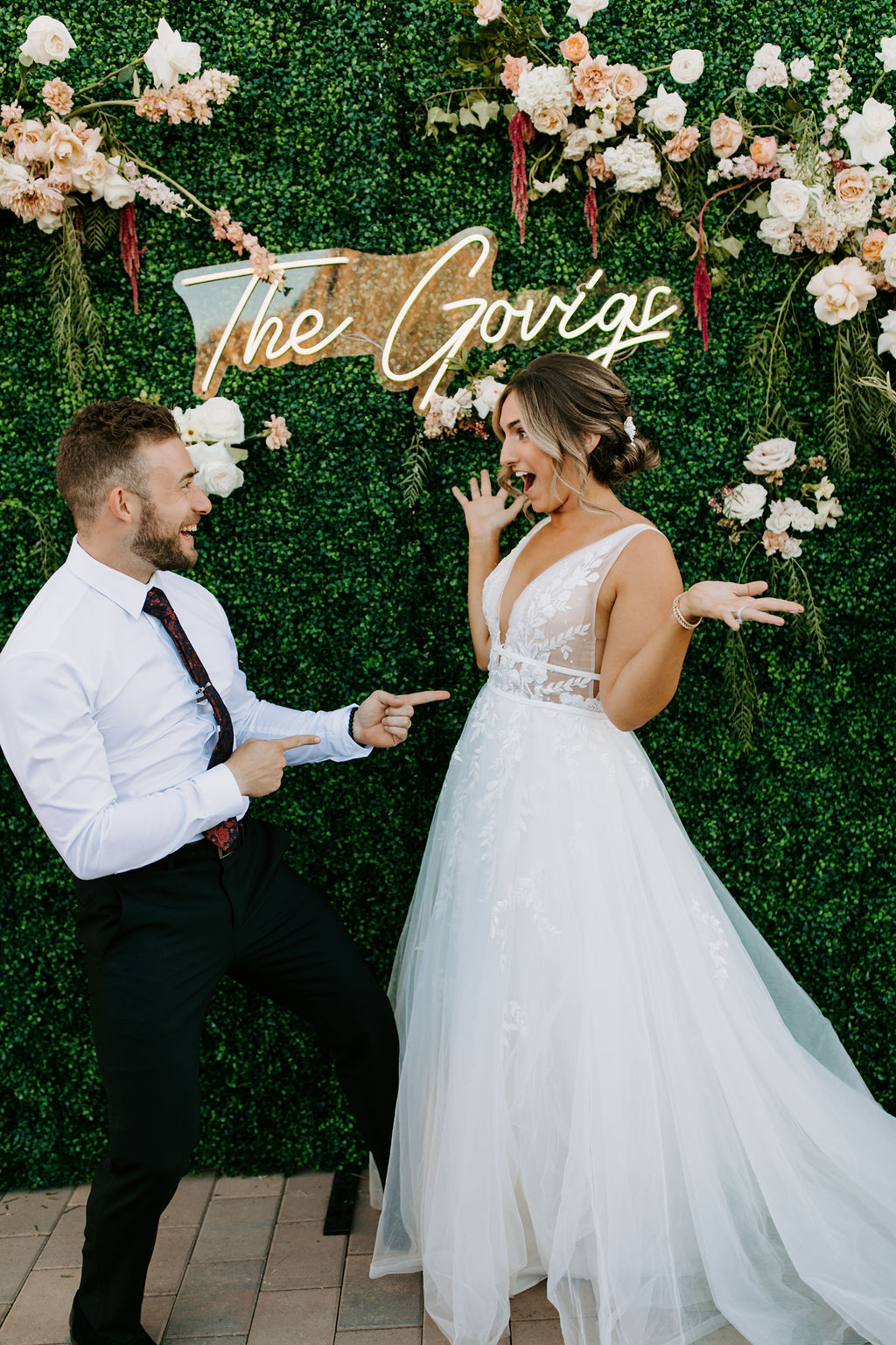 Bride and Groom with Photo backdrop and Neon Sign for Romantic Desert & Backyard Micro-Wedding