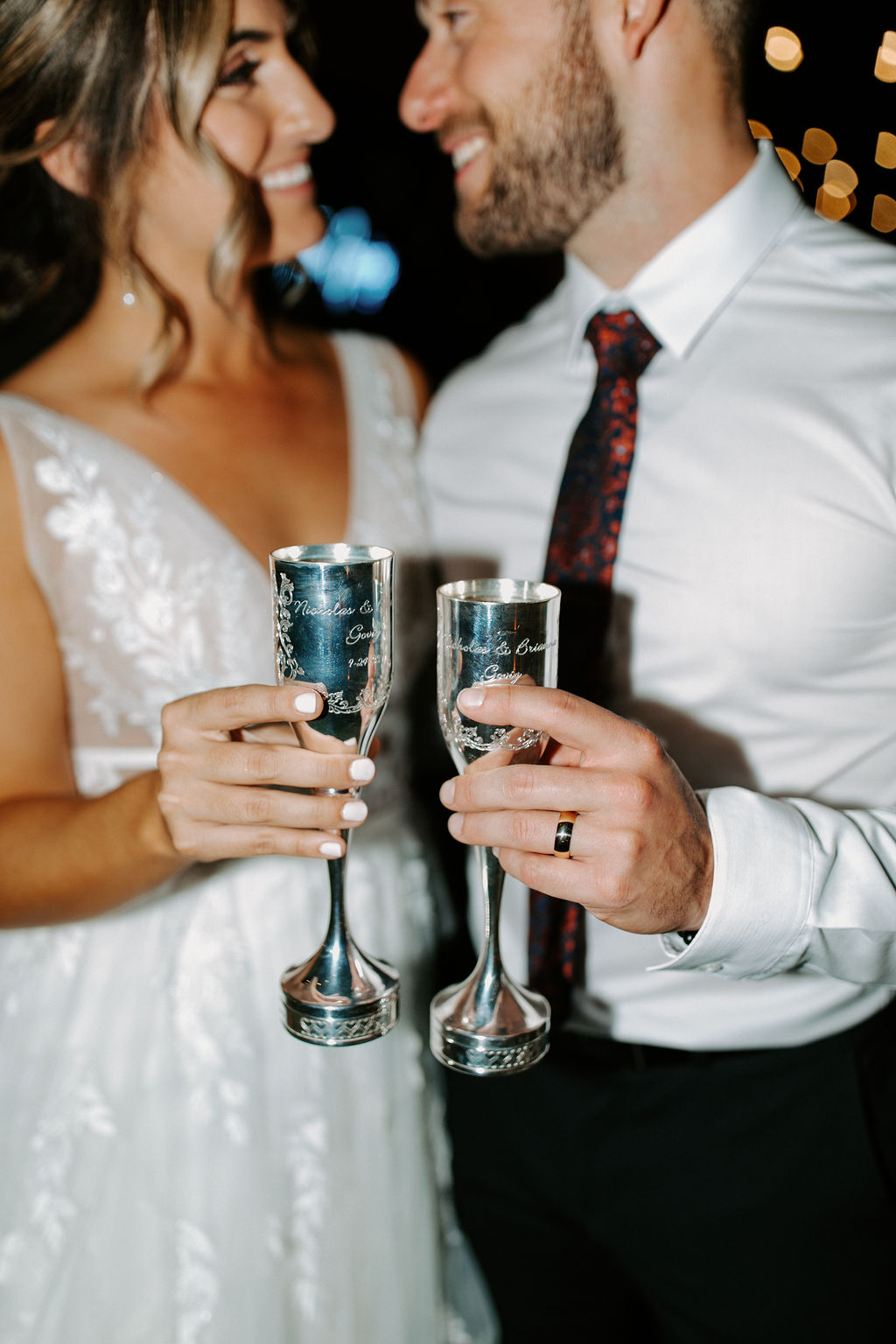 Bride and Groom doing toast with Custom champagne glasses 